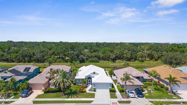 213 Venice Palms Blvd, Venice, FL 34292 - aerial perspective of suburban area with a heavily wooded area