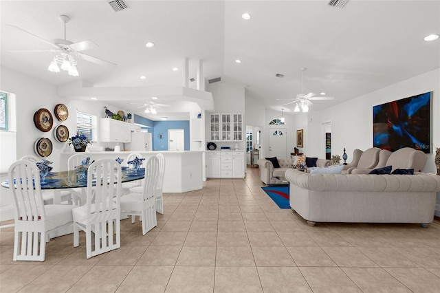 213 Venice Palms Blvd, Venice, FL 34292 - living room featuring a ceiling fan, vaulted ceiling, light tile patterned flooring, and recessed lighting