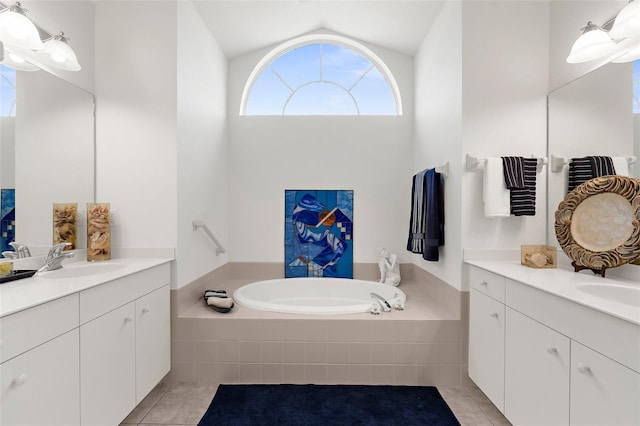 213 Venice Palms Blvd, Venice, FL 34292 - bathroom with tile patterned flooring, lofted ceiling, two vanities, and a bath