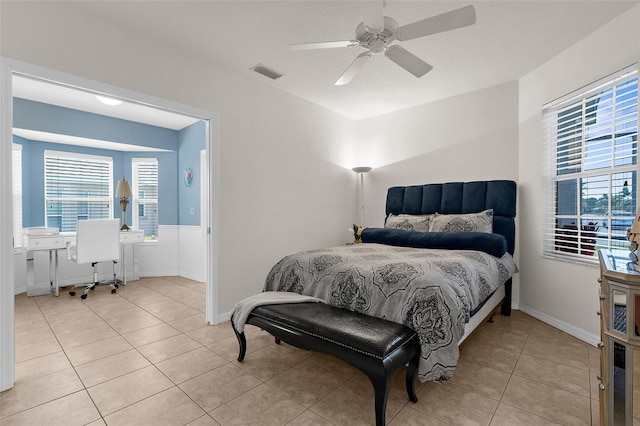 213 Venice Palms Blvd, Venice, FL 34292 - bedroom featuring a desk, multiple windows, light tile patterned floors, and a ceiling fan