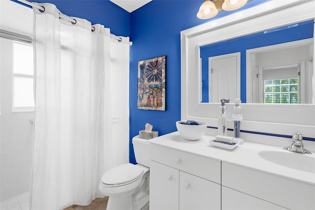 213 Venice Palms Blvd, Venice, FL 34292 - bathroom with vanity, a shower with shower curtain, and toilet