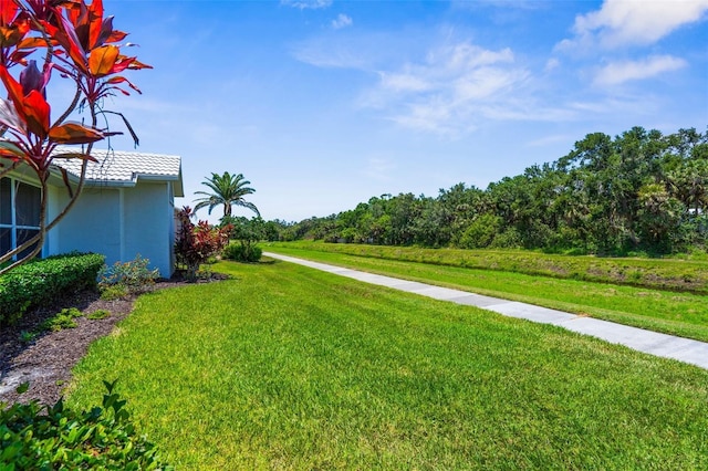 213 Venice Palms Blvd, Venice, FL 34292 - view of green lawn featuring a view of trees