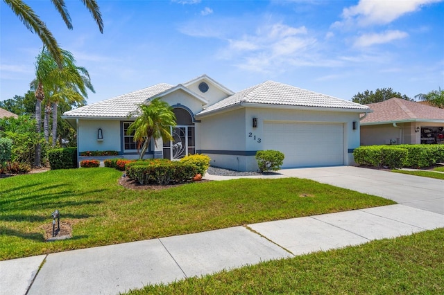 213 Venice Palms Blvd, Venice, FL 34292 - ranch-style home featuring an attached garage, concrete driveway, a front lawn, and stucco siding