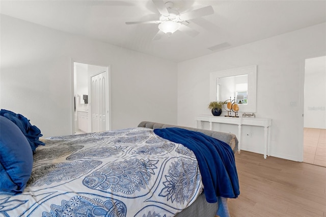 213 Venice Palms Blvd, Venice, FL 34292 - bedroom featuring wood finished floors, a ceiling fan, and ensuite bathroom