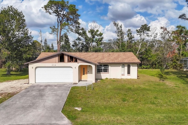 ranch-style house with a front yard, concrete driveway, and an attached garage