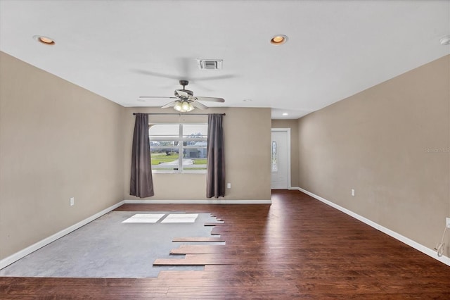 unfurnished room with dark wood-style floors, recessed lighting, visible vents, and baseboards