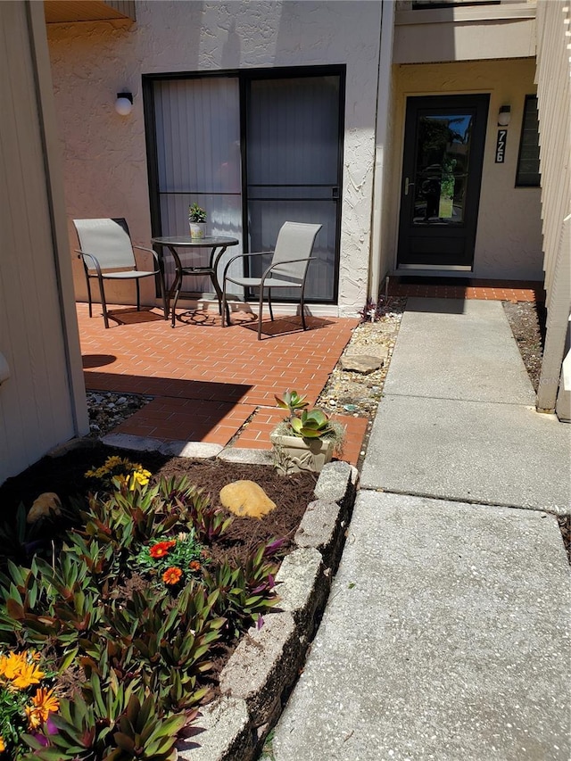 property entrance with a patio area