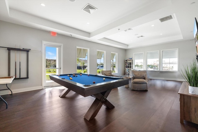 rec room with visible vents, a raised ceiling, baseboards, and wood finished floors