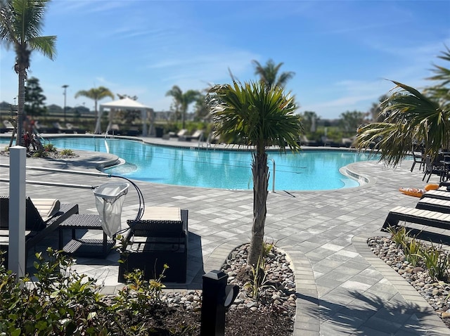 pool featuring a patio area