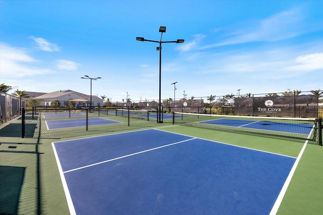 view of sport court with fence