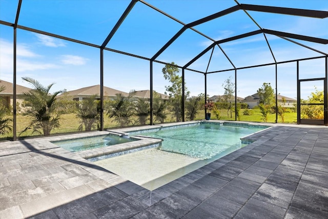 view of pool with a patio area, a pool with connected hot tub, and a lanai