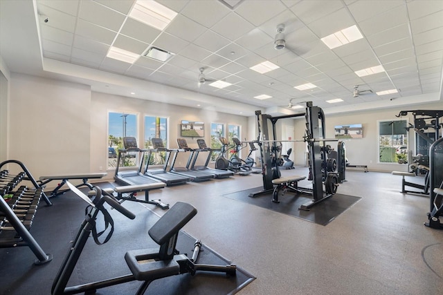 gym with a wealth of natural light, visible vents, and a paneled ceiling