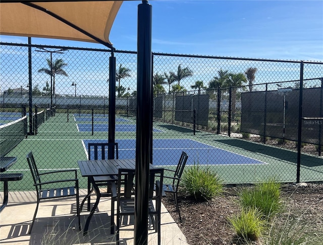 view of sport court with fence