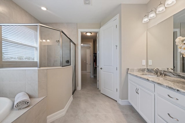 bathroom featuring vanity, visible vents, a shower stall, tile patterned floors, and a bath