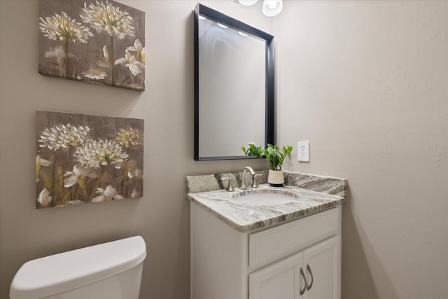 half bath with toilet and vanity