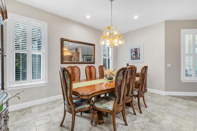 dining area featuring a notable chandelier, recessed lighting, and baseboards