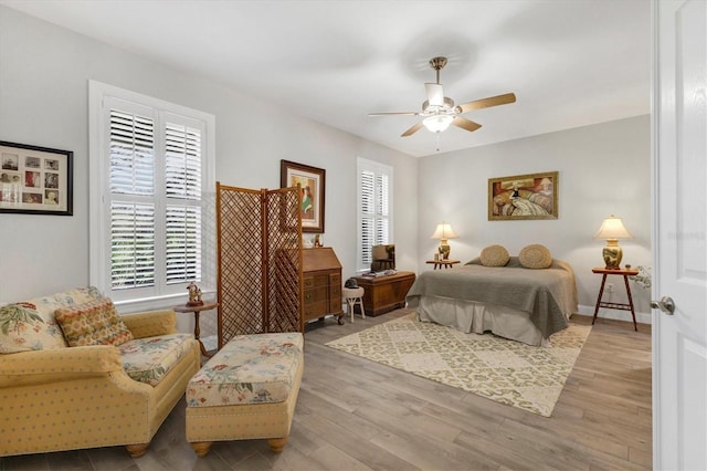 bedroom with wood finished floors and a ceiling fan