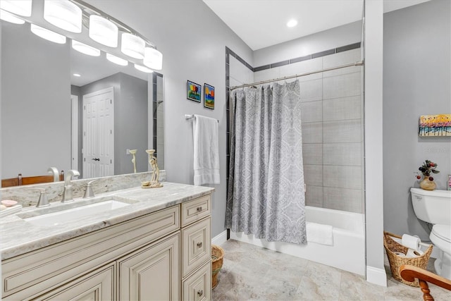 full bath with vanity, shower / tub combo, toilet, and baseboards