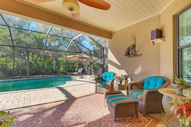 view of patio / terrace with a lanai and an outdoor pool