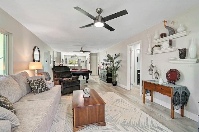 living room featuring light wood-style floors, billiards, baseboards, and a ceiling fan