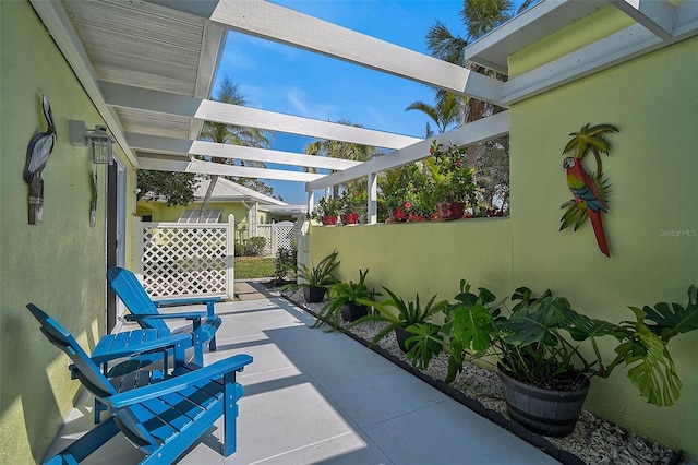 view of patio / terrace featuring fence