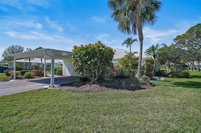 exterior space with a carport and driveway