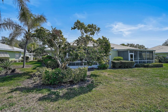 view of yard with a sunroom