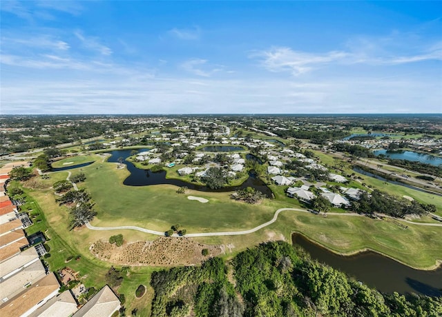 birds eye view of property featuring view of golf course and a water view