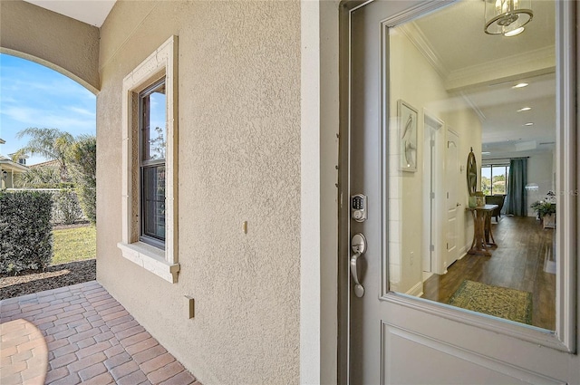 entrance to property with stucco siding