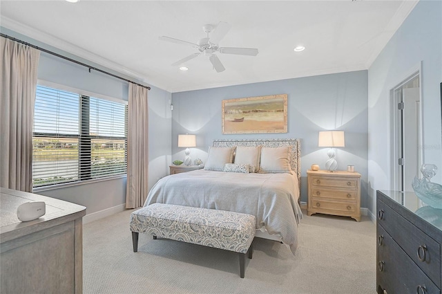 bedroom with recessed lighting, light colored carpet, a ceiling fan, baseboards, and crown molding