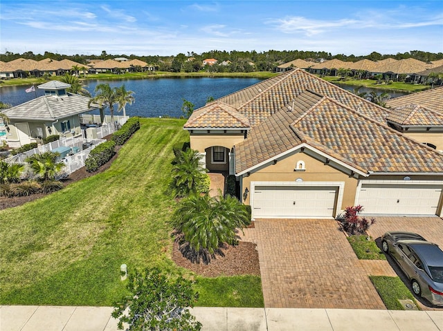 birds eye view of property with a water view