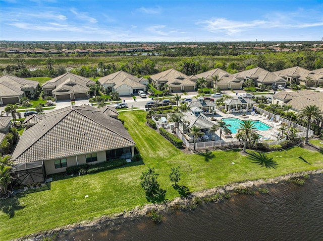 bird's eye view with a residential view and a water view