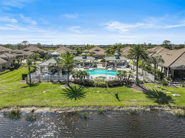 drone / aerial view featuring a water view and a residential view