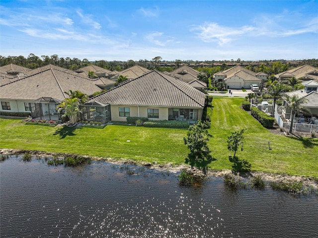 birds eye view of property featuring a residential view and a water view