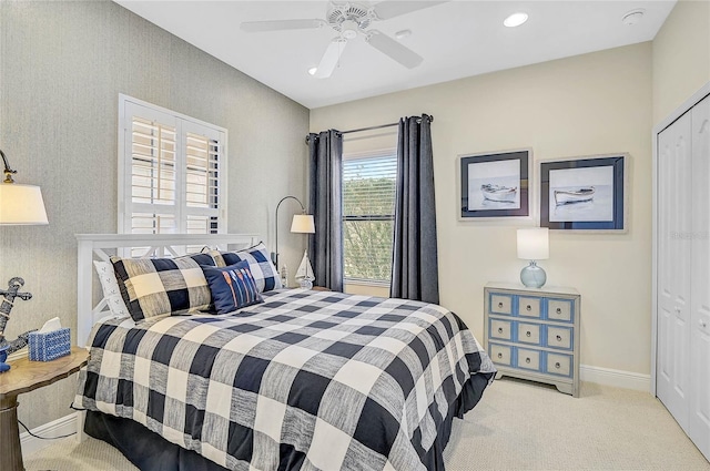 carpeted bedroom with ceiling fan, a closet, recessed lighting, and baseboards