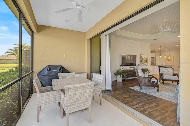 sunroom / solarium with ceiling fan