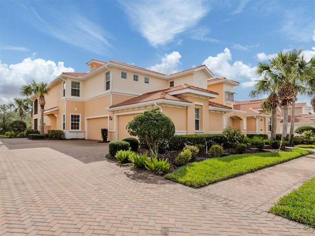 142 Bella Vista Ter Unit A, North Venice, FL 34275 - mediterranean / spanish home with a garage