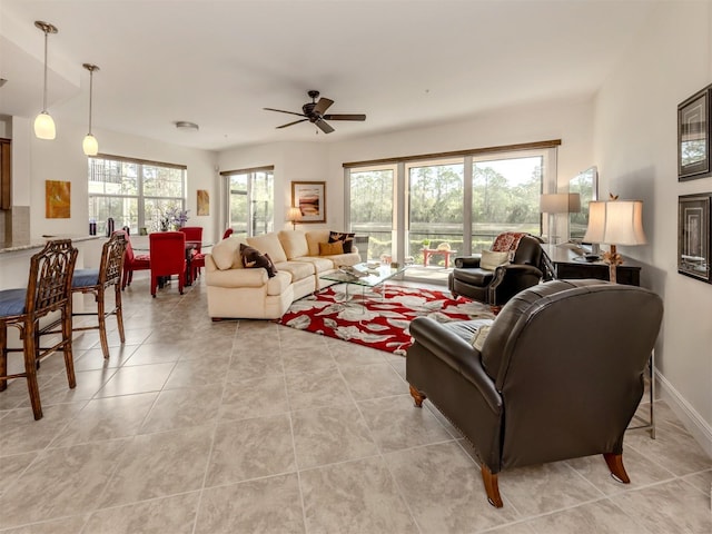 tiled living room with ceiling fan