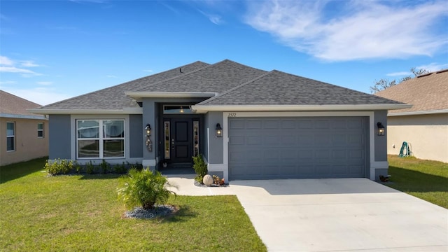 single story home featuring an attached garage, a shingled roof, a front lawn, and stucco siding