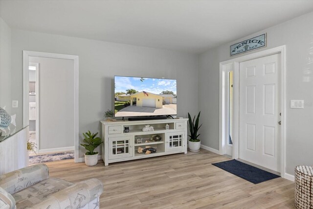 929 The Rialto, Venice, FL 34285 - living area featuring light wood finished floors and baseboards