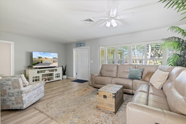 929 The Rialto, Venice, FL 34285 - living room featuring ceiling fan, visible vents, and wood finished floors