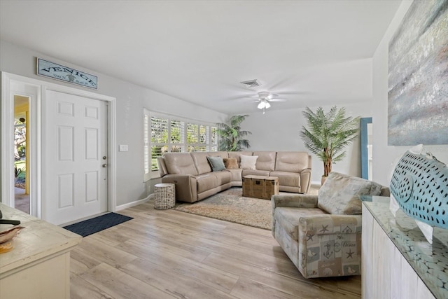 929 The Rialto, Venice, FL 34285 - living area with baseboards, a ceiling fan, visible vents, and light wood-style floors