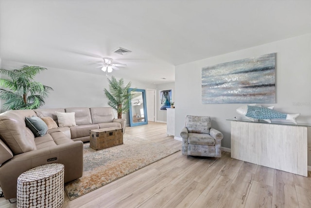 929 The Rialto, Venice, FL 34285 - living area featuring baseboards, ceiling fan, visible vents, and wood finished floors