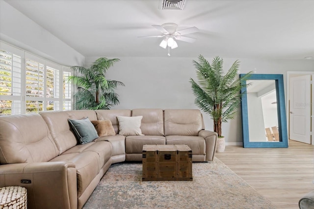 929 The Rialto, Venice, FL 34285 - living room with light wood-style floors, ceiling fan, visible vents, and baseboards