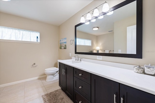 929 The Rialto, Venice, FL 34285 - bathroom with plenty of natural light, vanity, toilet, and tile patterned floors
