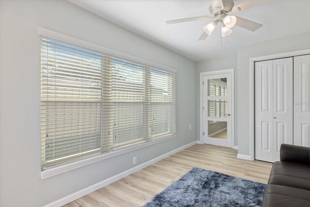 929 The Rialto, Venice, FL 34285 - living area featuring light wood-style floors, baseboards, and a ceiling fan