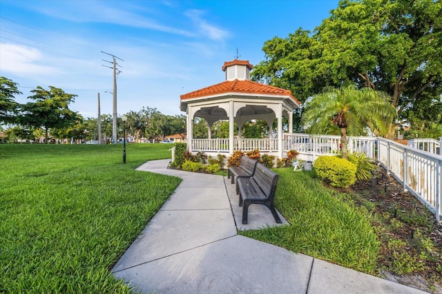 929 The Rialto, Venice, FL 34285 - view of community featuring a gazebo, fence, and a yard