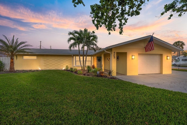 929 The Rialto, Venice, FL 34285 - single story home featuring driveway, a lawn, an attached garage, and stucco siding