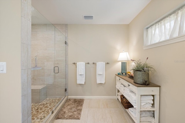 929 The Rialto, Venice, FL 34285 - bathroom featuring a stall shower, visible vents, vanity, and baseboards