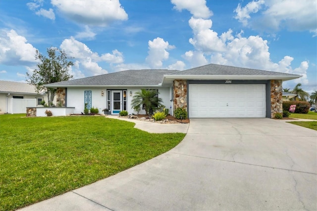 ranch-style home featuring a garage, concrete driveway, and a front lawn